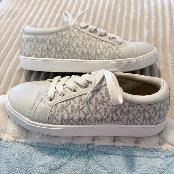 Michael Kors Shoes - Michael Kors Cream Monogram Sneakers. Tags says 5 but fit like women’s 7.5